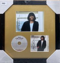 Autograph interest: A framed autographed photograph and CD cover by Joan Armatrading. Frame size