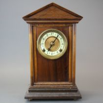 A 19th century oak mantel clock, H. 40cm. Slightly A/F to dial.