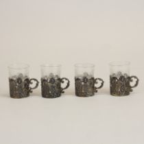 A set of four continental hallmarked silver liqueur glass holders and liners, H. 5cm.