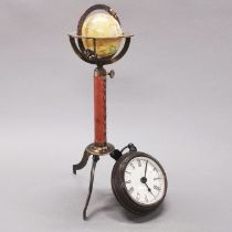 A small metal globe on stand, H. 29cm. Together with a brass pocketwatch clock.
