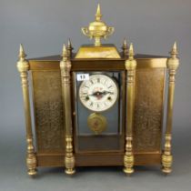 A large 20th C. gilt brass mantle clock, H. 57cm. W.49cm.
