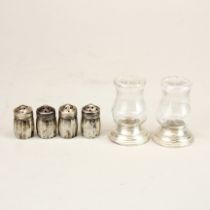Four sterling silver pepper/pounce pots, H. 3.2cm. Together with a pair of sterling silver and