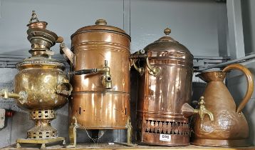Three large antique copper urns / samovar and a copper jug, tallest 46cm.