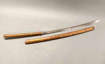 A 19th/early 20th century Burmese Dah sword, L. 96cm.