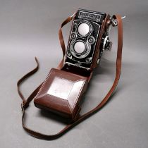 A Rolleiflex twin lens reflex camera.