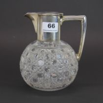 A hallmarked silver and cut crystal claret jug, H. 17cm.