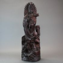 A Chinese carved wooden figure of Guanyin, H. 58cm.