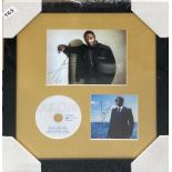 Autograph interest: A framed autographed photograph and CD cover by Akon. Frame size 42 x 42cm.