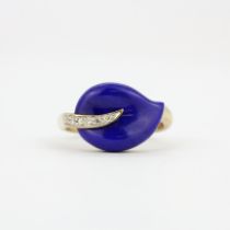 A 9ct yellow gold ring set with carved lapis lazuli and diamonds, (P.5).
