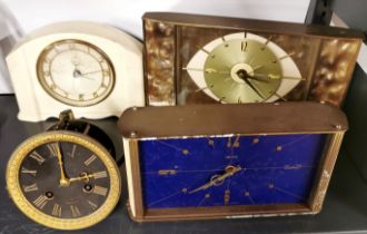 A cream bakelite mantle clock with two vintage brass mantle clocks and a 19th century Belgian