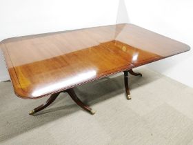A large inlaid mahogany extending dining table with one leaf, 205 x 120cm (not extended in photo).