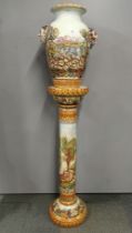 An impressive large Capodimonte hand painted vase and stand, H. 145cm.