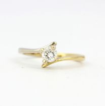 An 18ct yellow and white gold ring set with a brilliant cut diamond, (M).