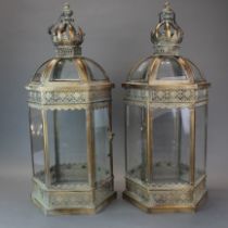 A pair of metal and glass garden lanterns, H. 64cm.