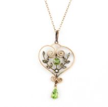 An Edwardian 9ct yellow gold pedant and chain set with peridots and split pearls, L. 5cm.
