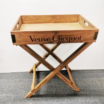 A champagne advertising tray and stand 65 x 45 x 79cm.