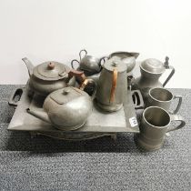 A quantity of 1920's hammered pewter with a silver plated gallery tray.
