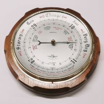 A Shortlands instruments teak framed barometer, Dia. 27cm.