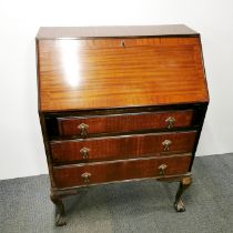 A five drawer mahogany drop down bureau with ball and claw feet, 103 x 76 x 44cm. One leg A/F.