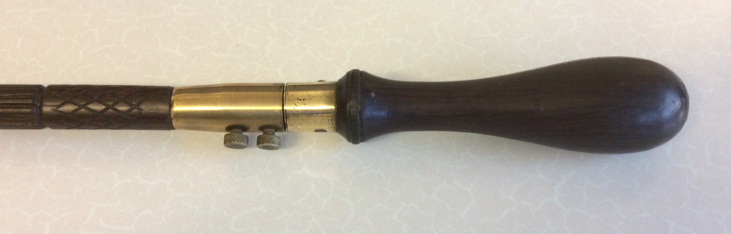 A simple rosewood stick with a brass section set just below the handle. Two small bolts hold the - Image 2 of 8