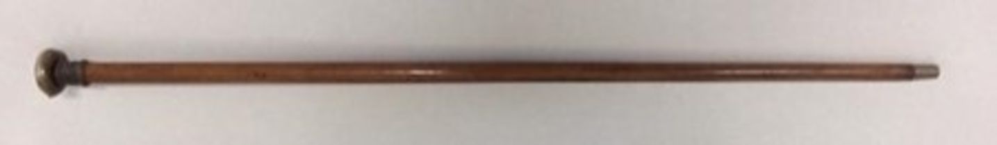 An attractive cane which has a brass handle. The upper section consists of a hinged compartment