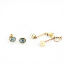 A pair of 9ct London blue topaz set stud earrings together with a pair of 9ct screw back fitted