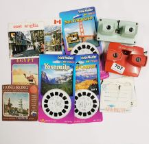 Three Viewmaster 3D viewers and a collection of disks.