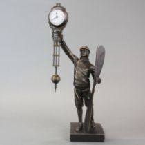 A bronze pendulum clock figure of a WWI pilot, H. 38cm.