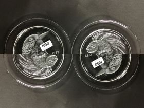 Two Lalique crystal year plates for 1973 and 1975.