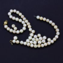 An 18ct yellow gold clasp pearl necklace, needs re-stringing.