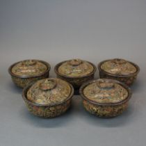 A boxed set of Oriental carved lacquer bowls and covers. Bowl Dia. 13cm.