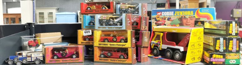 A collection of boxed Matchbox diecast models of Yesteryear with a group of unboxed vehicles,
