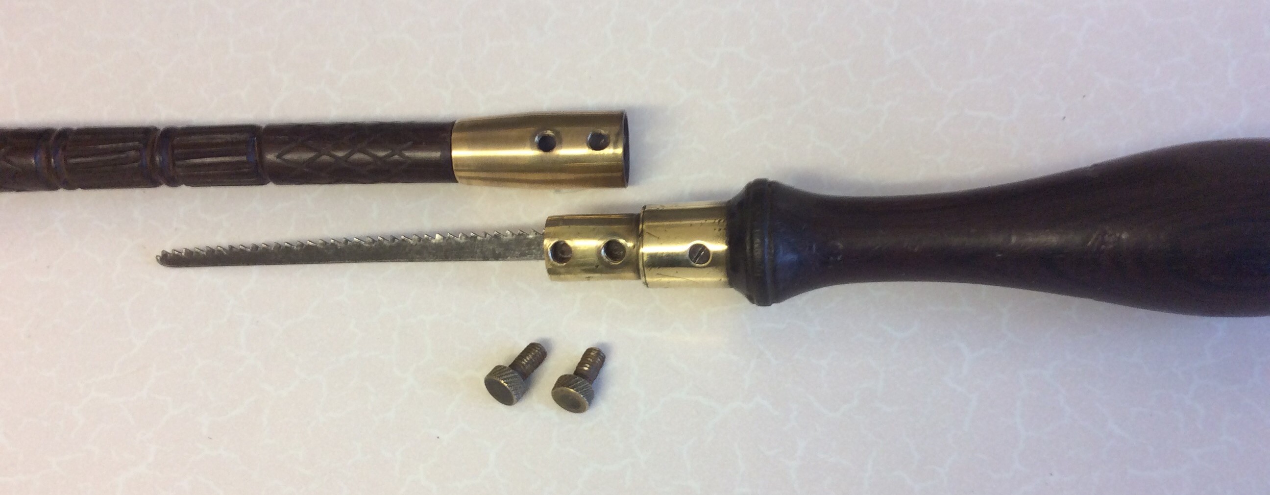 A simple rosewood stick with a brass section set just below the handle. Two small bolts hold the - Image 4 of 8