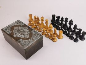 A vintage turned wooden chess set in a silver decorated wooden case, king height 8.3cm.