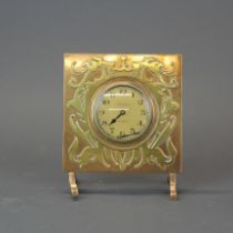 An Art Nouveau design Waltham brass and bronze clock, 13 x 15cm.