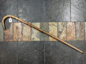 This is a late 19C saw cane by John Jacob Holtzapffel. The saw nestles in a groove in the Stick,