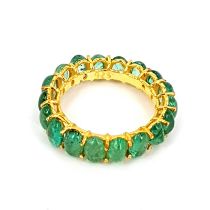 A gold on 925 silver full eternity ring set with cabochon cut emeralds (R).