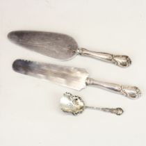 A pair of white metal (tested silver) handled cake and cheese servers, together with a California