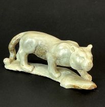 A hand carved stag antler lion/tiger, L. 6.5cm.