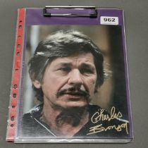 Autograph interest. A signed photograph of Charles Bronson with certificate.