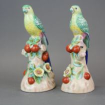A pair of continental porcelain figures of parrots, H. 24cm.