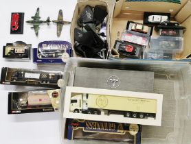 A quantity of die cast Guiness advertising models and others.