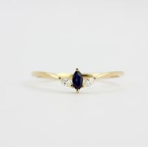 An 18ct yellow gold ring set with a marquise cut sapphire and marquise cut diamonds, (N).