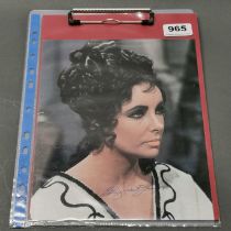 Autograph interest. A signed photograph of Elizabeth Taylor with certificate.
