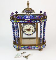 A large enamelled brass mantle clock, H. 45cm.