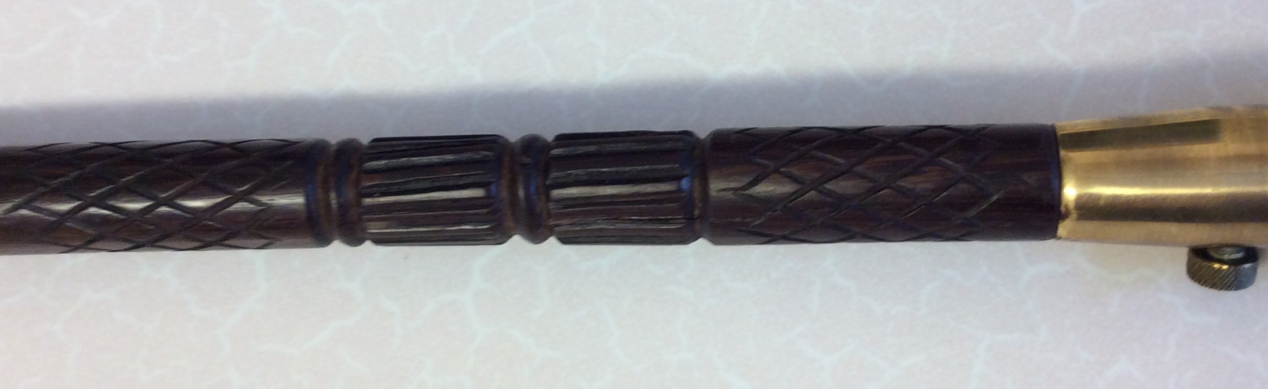 A simple rosewood stick with a brass section set just below the handle. Two small bolts hold the - Image 3 of 8