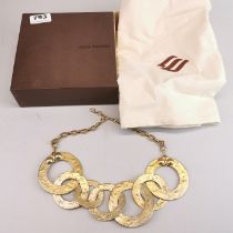 A boxed Louis Vuitton gilt metal necklace.