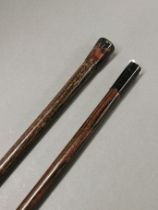 Two 19th century walking sticks with turned horn handles, L. 89cm.