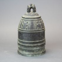 A 19th century Eastern bronze temple bell, H. 21cm.