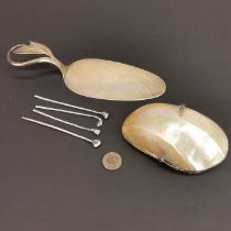 A hallmarked silver and shell basket with a continental silver cake slice by DeluKaandanlr, and four
